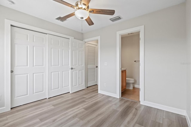 unfurnished bedroom with ensuite bathroom, ceiling fan, light hardwood / wood-style floors, and a closet