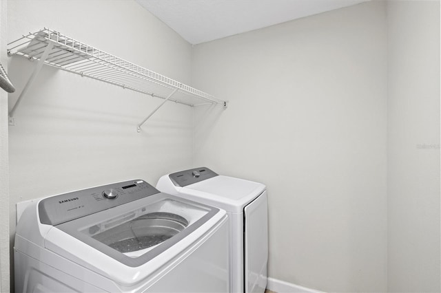 laundry area with washer and dryer