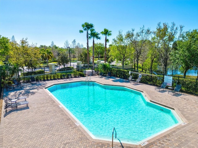 view of swimming pool with a patio area