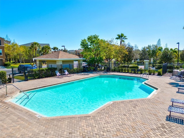 view of swimming pool with a patio area