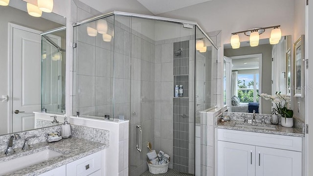 bathroom featuring vanity and an enclosed shower