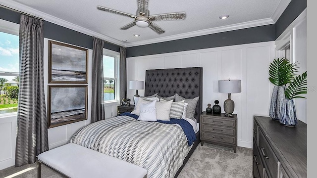 bedroom with light carpet, ceiling fan, ornamental molding, and a textured ceiling