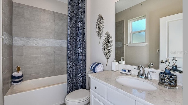 full bathroom with vanity, shower / bath combo with shower curtain, and toilet