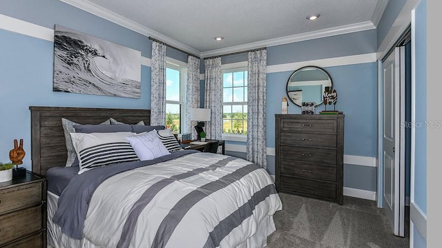 carpeted bedroom with ornamental molding and a textured ceiling