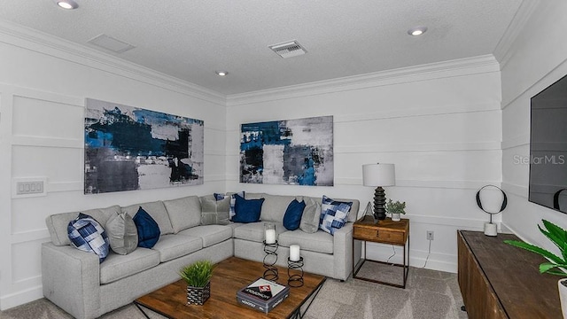 living room featuring light carpet, ornamental molding, and a textured ceiling