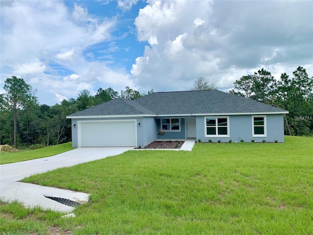 ranch-style home with a garage and a front yard