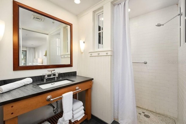 bathroom with vanity and a shower with shower curtain