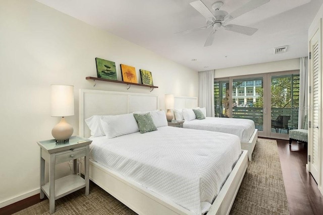 bedroom with access to exterior, dark wood-type flooring, and ceiling fan