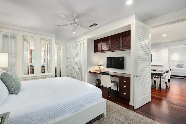 bedroom with ceiling fan and dark hardwood / wood-style flooring