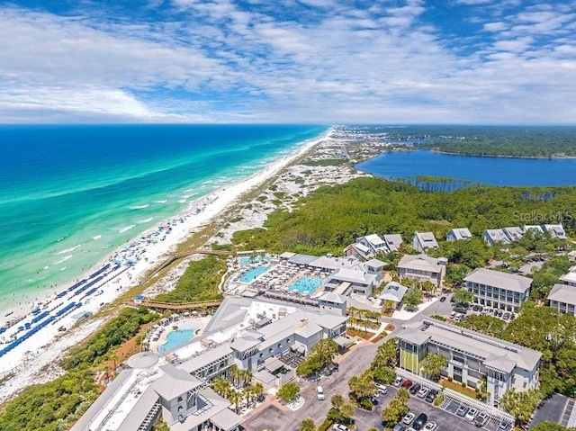 aerial view with a water view and a view of the beach