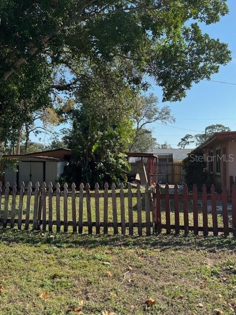 exterior space featuring a yard and a shed