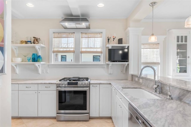 kitchen with a sink, decorative light fixtures, light stone counters, appliances with stainless steel finishes, and open shelves