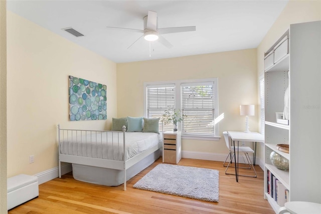 bedroom with hardwood / wood-style floors and ceiling fan