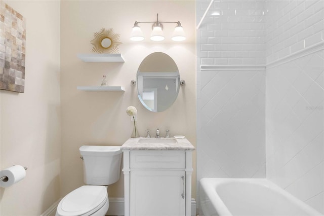 full bathroom with vanity, tiled shower / bath, and toilet