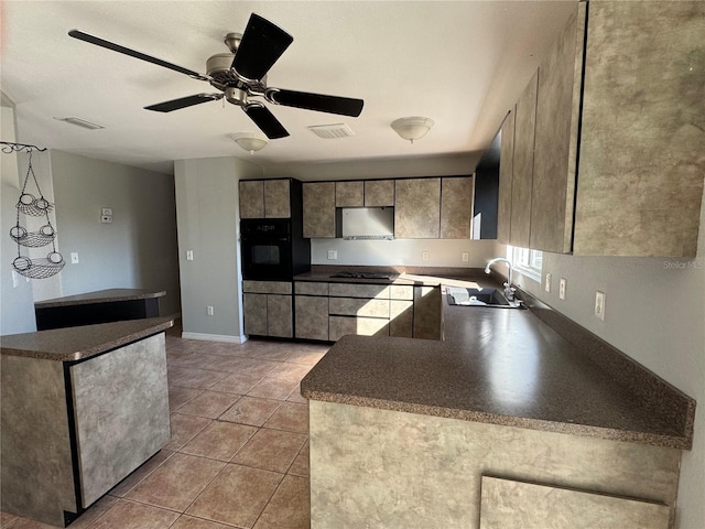 kitchen with sink, light tile patterned floors, ceiling fan, oven, and stainless steel gas stovetop