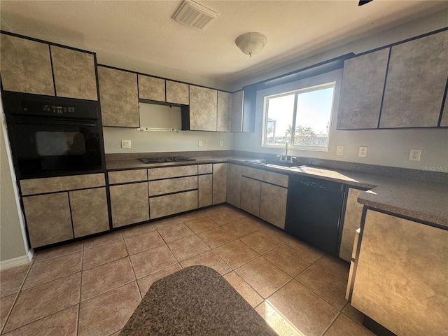 kitchen with sink, light tile patterned floors, and black appliances