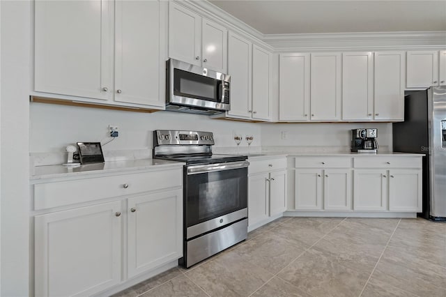 kitchen featuring white cabinets and appliances with stainless steel finishes