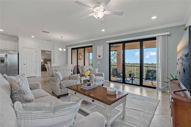 living room featuring crown molding, ceiling fan with notable chandelier, and light tile patterned floors