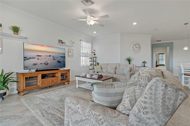 tiled living room featuring ornamental molding and ceiling fan