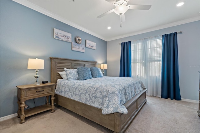 carpeted bedroom featuring ornamental molding and ceiling fan