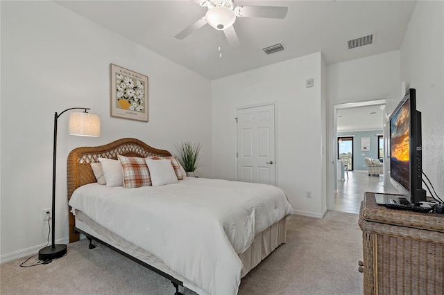 bedroom with light carpet and ceiling fan