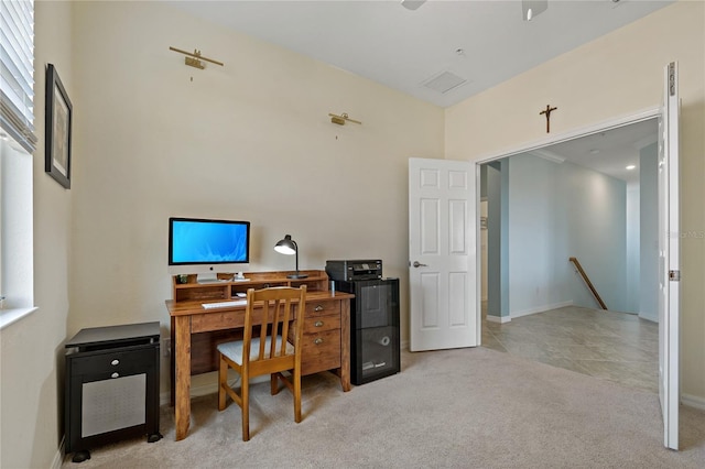 home office with light colored carpet