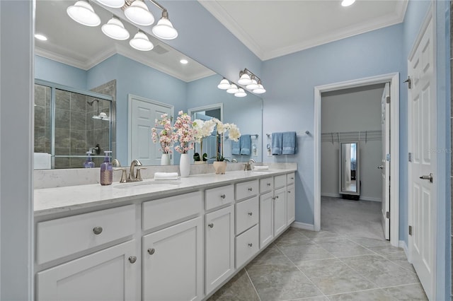 bathroom with vanity, tile patterned flooring, ornamental molding, and walk in shower