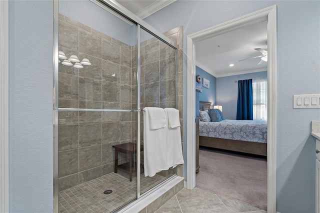 bathroom featuring an enclosed shower, vanity, tile patterned floors, and ornamental molding