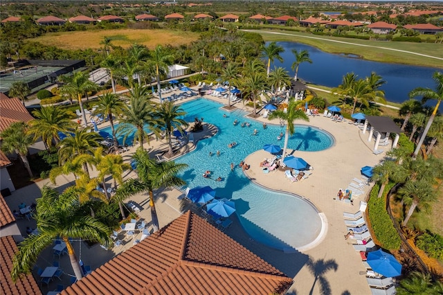 birds eye view of property with a water view