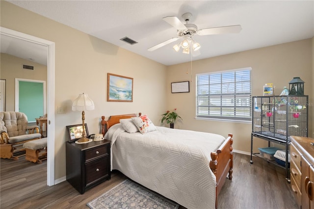 bedroom featuring dark hardwood / wood-style floors and ceiling fan