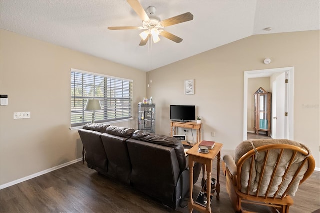 living room with dark wood-type flooring, ceiling fan, and vaulted ceiling