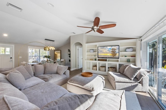 living room featuring vaulted ceiling, hardwood / wood-style floors, and ceiling fan