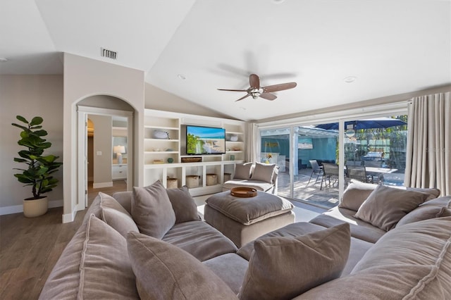 living room with hardwood / wood-style floors, vaulted ceiling, and ceiling fan