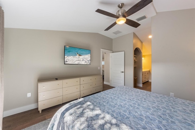 bedroom with ceiling fan, dark hardwood / wood-style floors, and vaulted ceiling