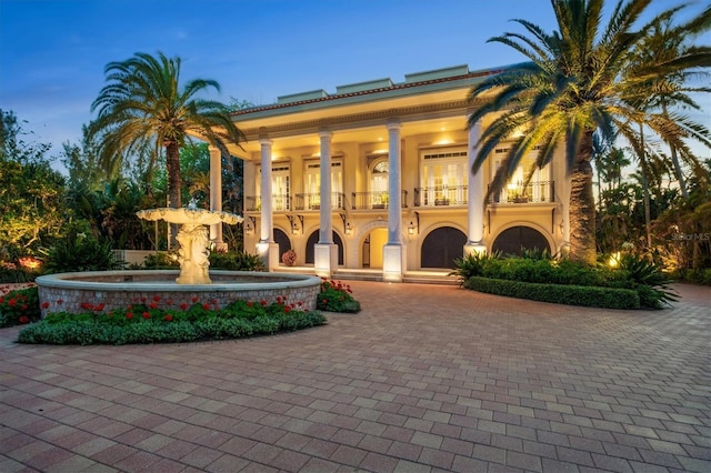 view of outdoor building at dusk