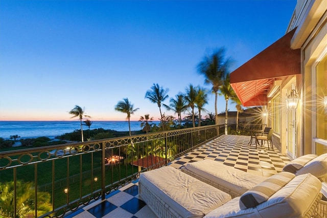 balcony at dusk with a water view