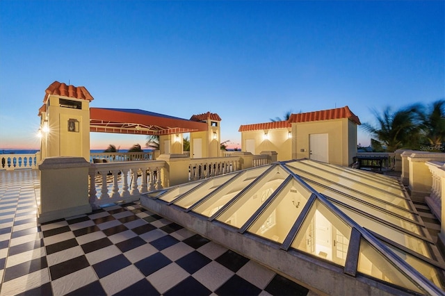 patio terrace at dusk with a water view