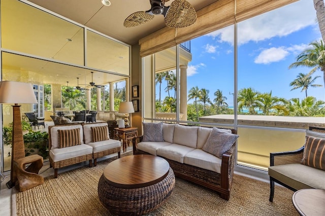 sunroom featuring ceiling fan