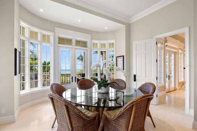 dining area featuring french doors and crown molding