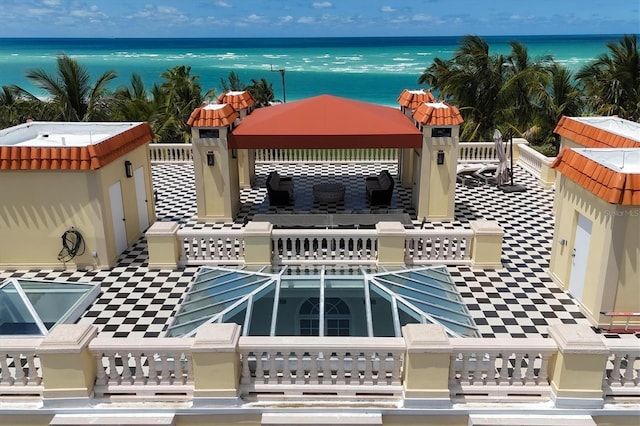 balcony featuring a water view