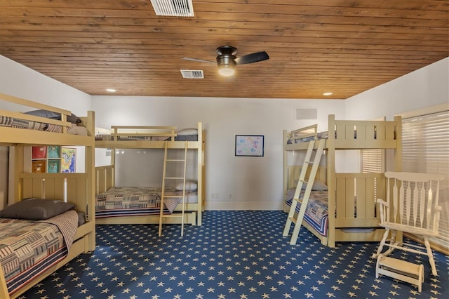 bedroom featuring wood ceiling and carpet flooring