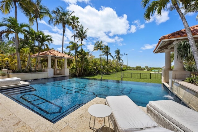 view of swimming pool featuring a gazebo, a patio area, pool water feature, and a lawn