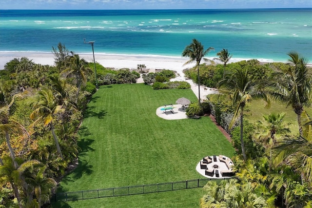 birds eye view of property with a view of the beach and a water view