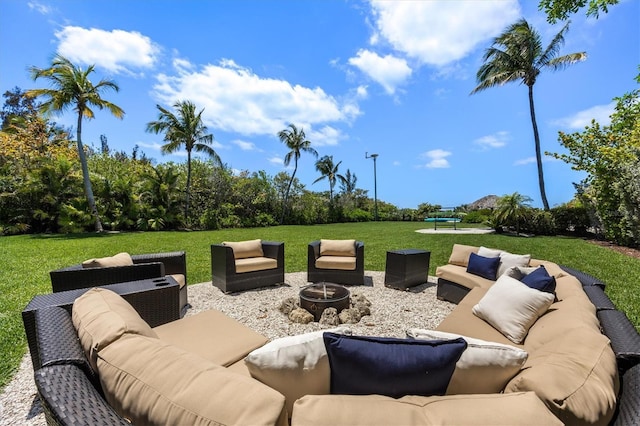 view of patio / terrace featuring an outdoor living space with a fire pit