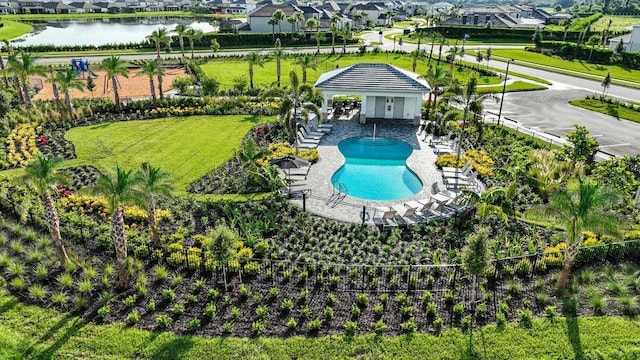 birds eye view of property with a water view