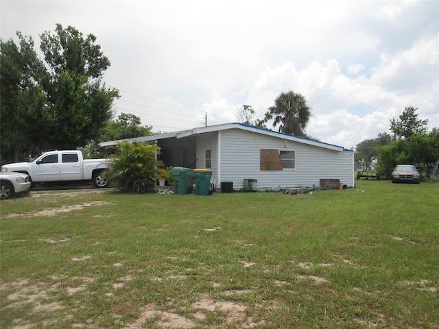 view of property exterior with a lawn