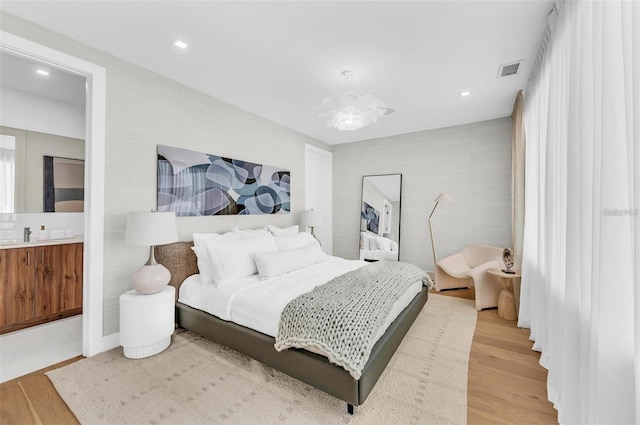 bedroom featuring light wood-type flooring