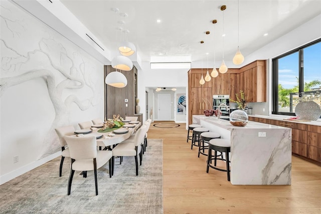 dining area featuring light wood-type flooring