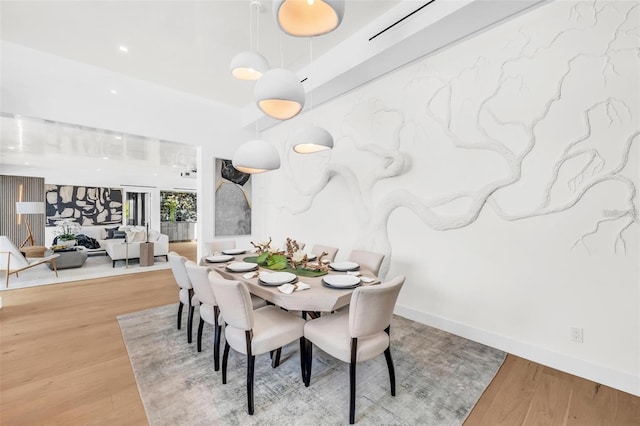 dining space featuring wood finished floors