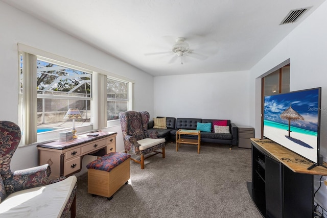 carpeted living room featuring ceiling fan